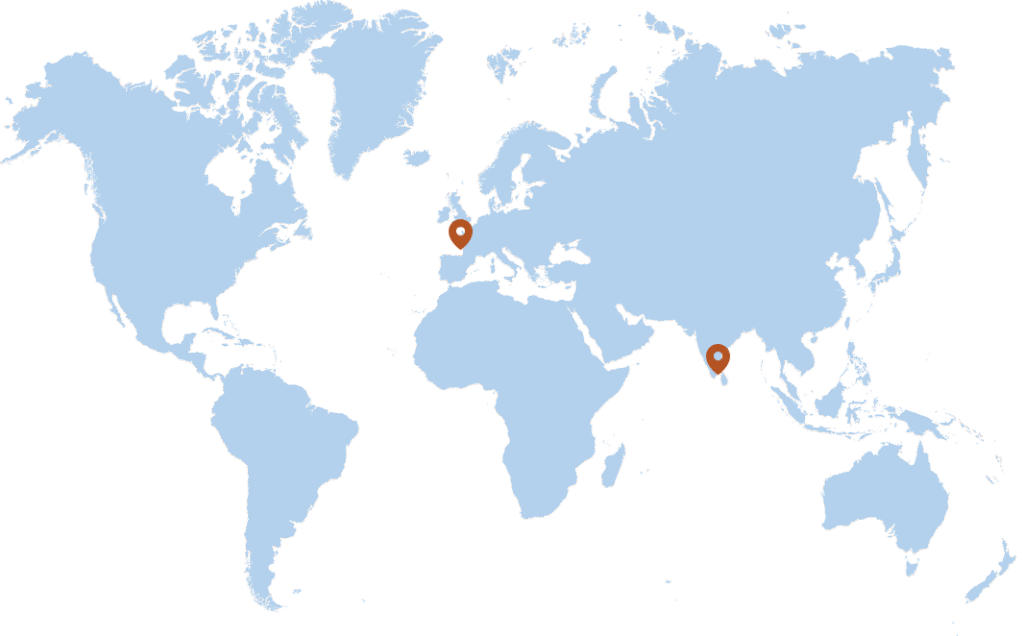 A world map with two orange location markers: one in Western Europe and one in South Asia, specifically in the region of France and the southern part of India or Sri Lanka.