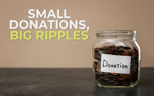 A hand placing a small donation into a jar, representing the impact of small, consistent giving.